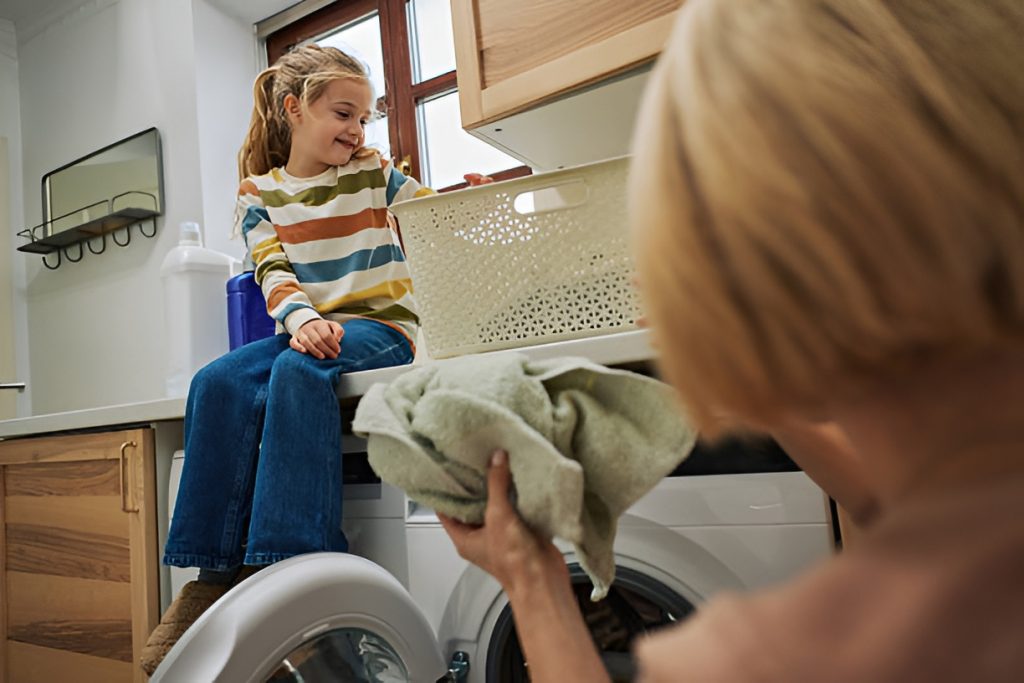 mother and daughter in a laundry room